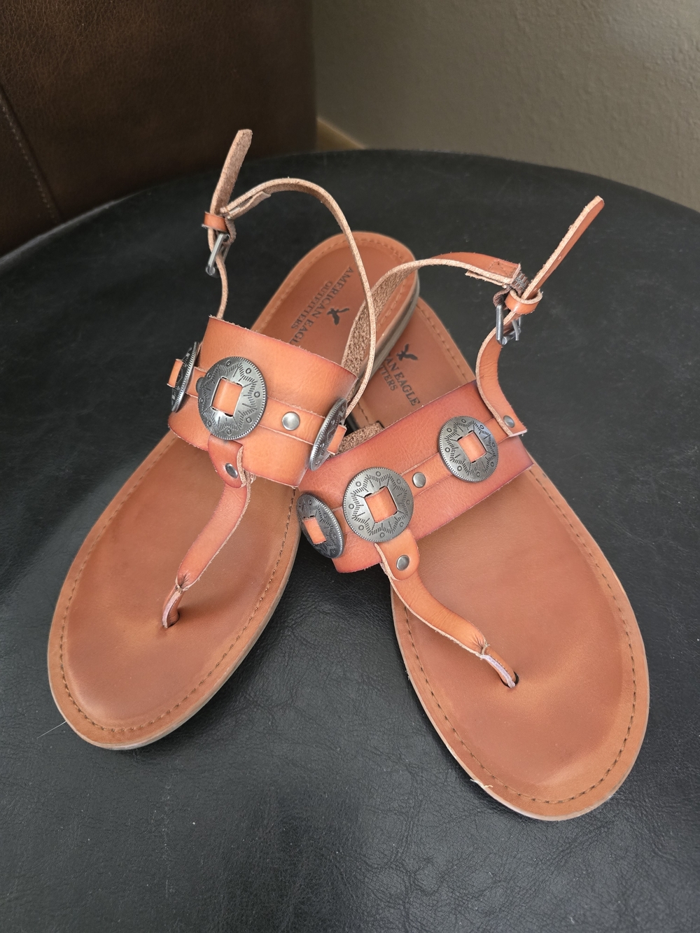 Brown Leather T-Strap Sandals with Metal Accents